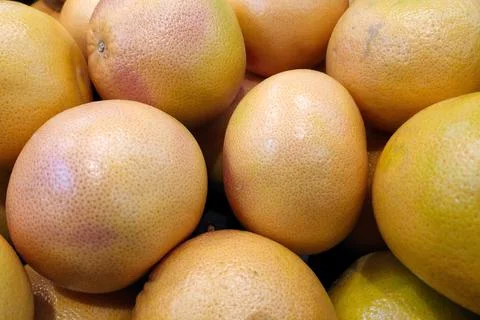 Stack of Grapefruits on a market stall Stock Photos