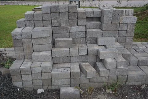 Stack of gray bricks for building construction Stock Photos