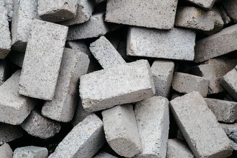 Stack of gray clay bricks for construction Stack of gray clay bricks for c... Stock Photos