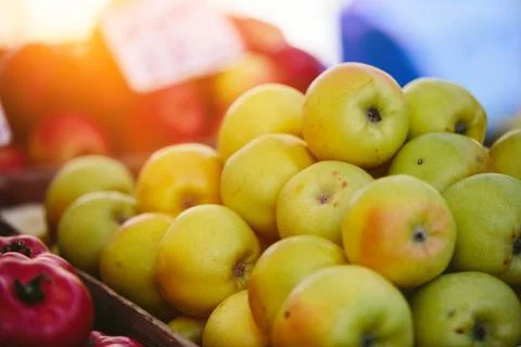 Stack of green apples at a greengrocer Stock Photos