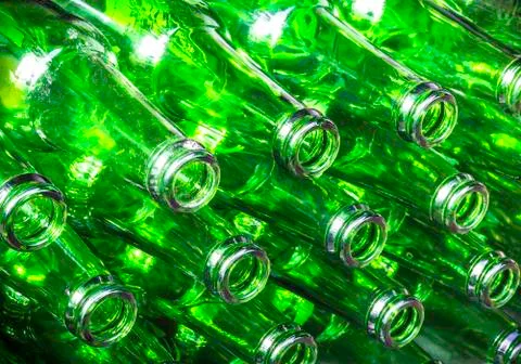 Stack of green color bottles Stock Photos