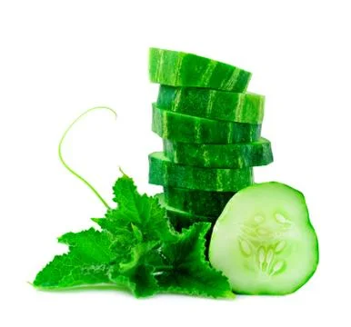 A stack of green cucumber slices with leaves on a white background. Stock Photos