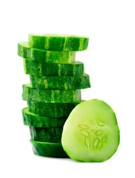 A stack of green cucumber slices on a white background. Stock Photos