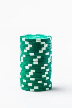 Stack of green poker chips on white background isolate Stock Photos