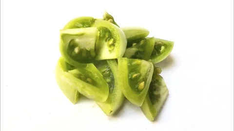 Stack of Green Tomato Pieces Stock Footage 279956614