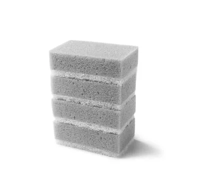 Stack of grey cleaning sponges on white background Fotos de archivo