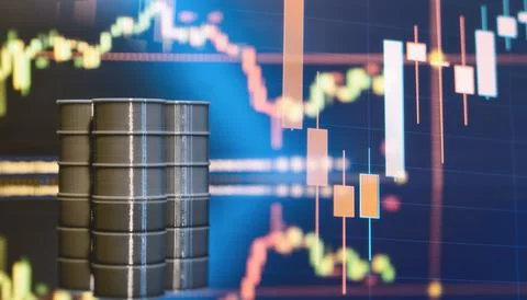 Stack of grey miniature crude oil barrels on a dark reflective surface with a 写真素材