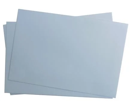 A stack of grey paper isolated on a white background.Texture or background Stock Photos