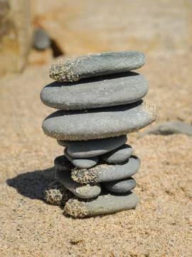 Stack of grey pebbles on the beach 스톡 사진