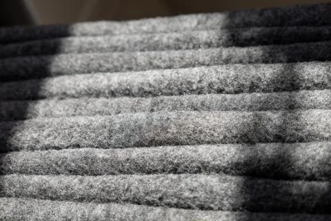 Stack of grey warm fleece blankets. Stock Photos
