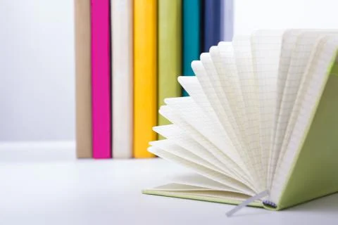 Stack of hadrback books on white background. Library education concept. Back to Foto stock