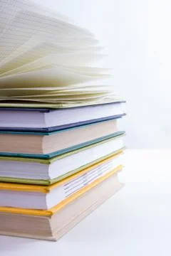 Stack of hadrback books on white background. Library education concept. Back to Stock Photos
