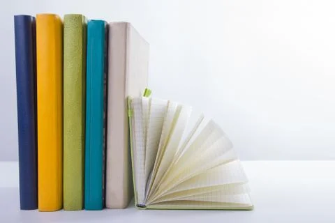 Stack of hadrback books on white background. Library education concept. Back to Stock Photos