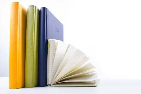 Stack of hadrback books on white background. Library education concept. Back to Stock-Fotos