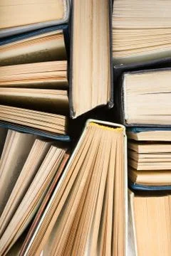 Stack of hadrback books on white background. Library education concept. Back to Stock Photos