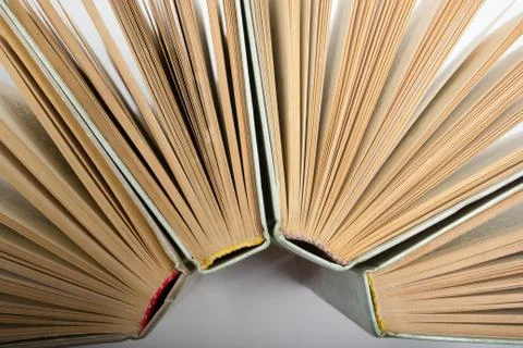 Stack of hadrback books on white background. Library education concept. Back to Stock Photos