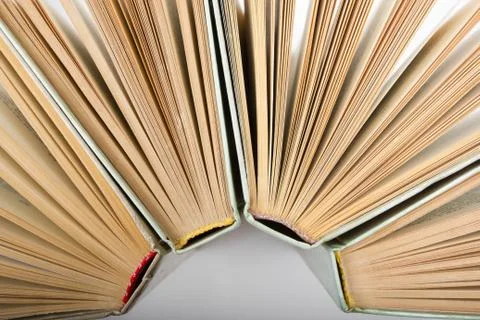 Stack of hadrback books on white background. Library education concept. Back to Stock-Fotos