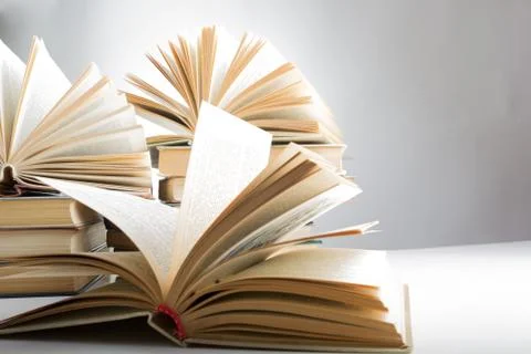 Stack of hadrback books on white background. Library education concept. Back to Stock Photos
