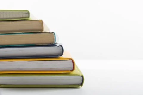 Stack of hadrback books on white background. Library education concept. Back to Stock Photos