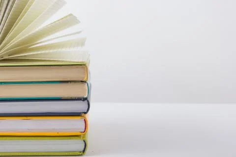Stack of hadrback books on white background. Library education concept. Back to Stock Photos