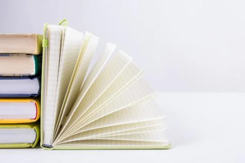 Stack of hadrback books on white background. Library education concept. Back to Stock Photos