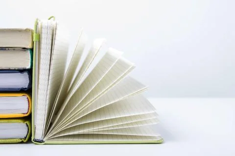 Stack of hadrback books on white background. Library education concept. Back to Stock-Fotos