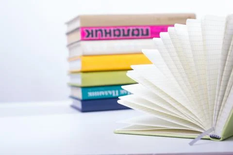 Stack of hadrback books on white background. Library education concept. Back to Stock Photos