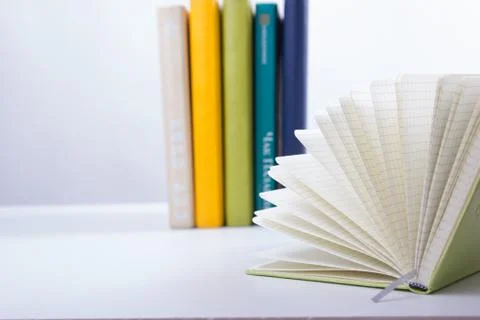 Stack of hadrback books on white background. Library education concept. Back to Stock Photos
