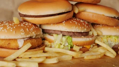 Stack of hamburger background cooking 4K unhealthy foods gourmet Stock-Footage 336578416