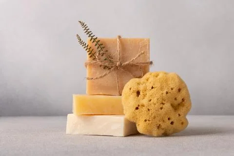 Stack of handcrafted soap bars and natural sea sponge. Natural, organic clean 写真素材