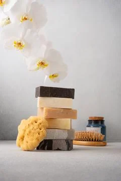 Stack of handcrafted soap bars and natural sponge. Natural, organic cleaning  Foto stock