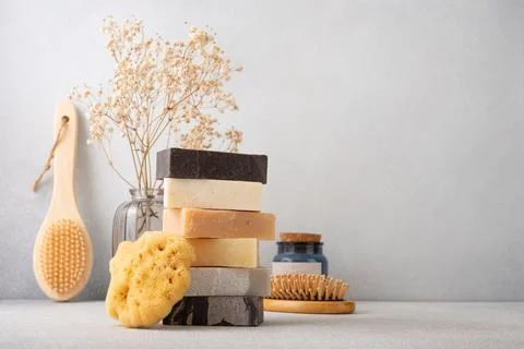 Stack of handcrafted soap bars and natural sponge. Natural, organic cleaning  Stock Photos