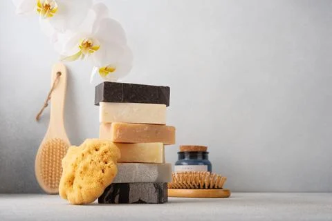 Stack of handcrafted soap bars and natural sponge. Natural, organic cleaning  Foto stock