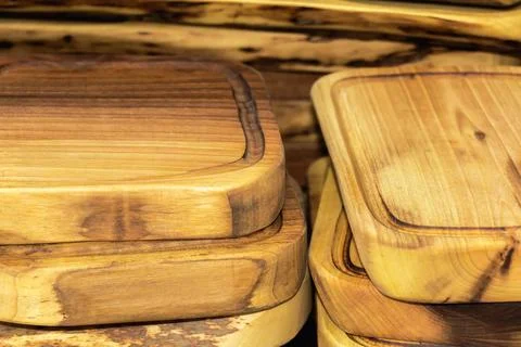 Stack of handcrafted wooden serving trays with rich grain patterns and smoo.. Stock Photos