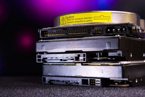 Stack of hard disk drives with connector caution label 스톡 사진