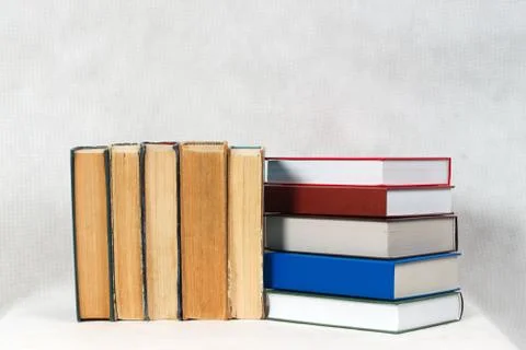 Stack of hardback books on table Stock Photos