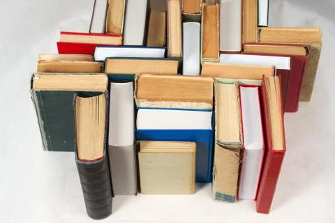 Stack of hardback books on table. Top view Stock Photos