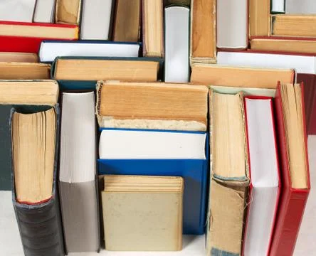 Stack of hardback books on table. Top view Stock Photos