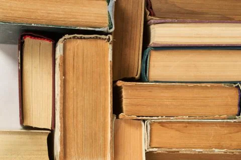 Stack of hardback books on table. Top view Stock Photos