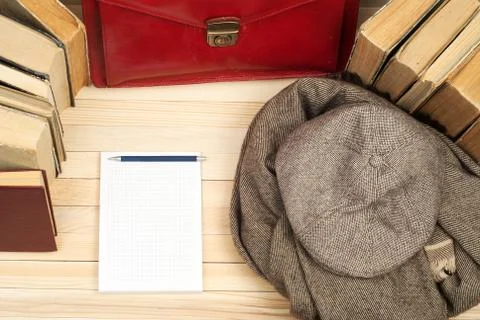 Stack of hardback books on wooden table. Back to school. Copy space. Top view Stock Photos