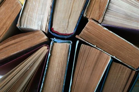 Stack of hardback books on wooden table. Back to school. Stock Photos