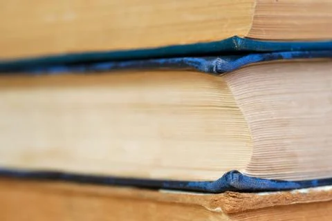 Stack of hardback books on wooden table. Back to school Stock Photos