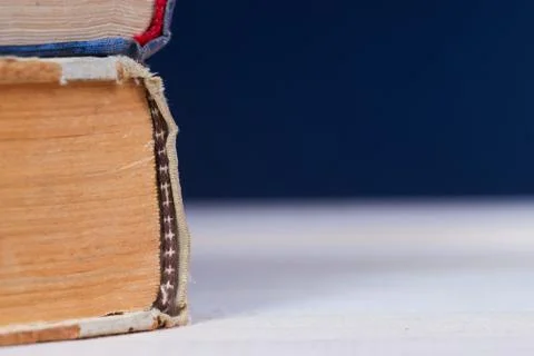 Stack of hardback books on wooden table. Back to school Stock Photos