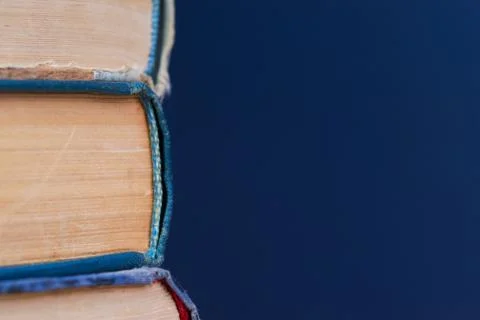 Stack of hardback books on wooden table. Back to school Stock Photos