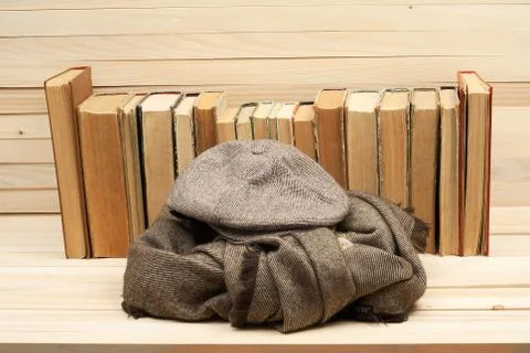 Stack of hardback books on wooden table Stock Photos