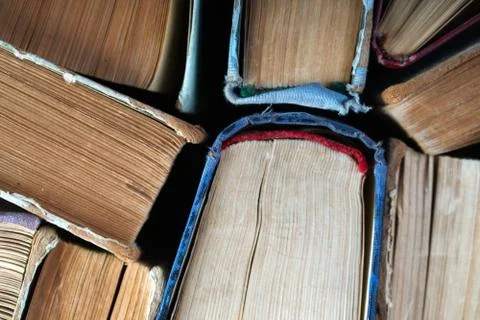 Stack of hardback books on wooden table. Back to school. 写真素材