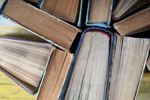 Stack of hardback books on wooden table. Back to school. Stock Photos