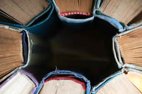 Stack of hardback books on wooden table. Back to school. Stock Photos
