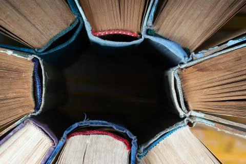 Stack of hardback books on wooden table. Back to school. Stock Photos
