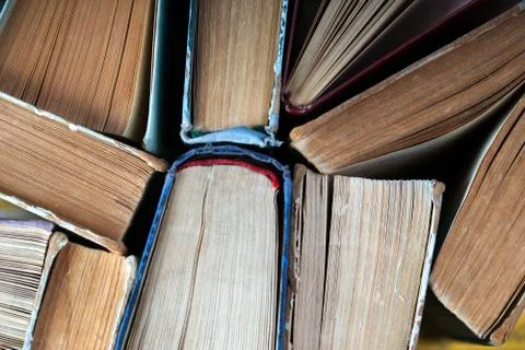Stack of hardback books on wooden table. Back to school Stock Photos